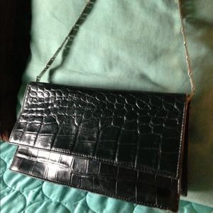 Black Aigner purse with silver chain handle.